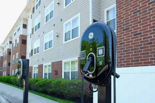 a couple of parking meters in front of a building at Residence Inn Poughkeepsie in Poughkeepsie