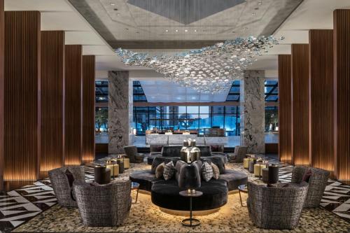 a lobby with couches and chairs and a chandelier at The Ritz-Carlton, Chicago in Chicago