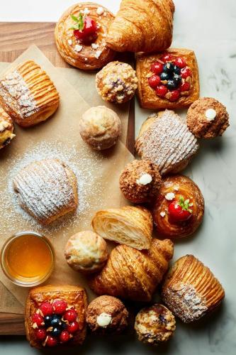a bunch of pastries sitting on a cutting board at The Resort at Pelican Hill in Crystal Cove