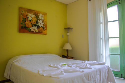 Katil atau katil-katil dalam bilik di Hotel Caledônia Inn