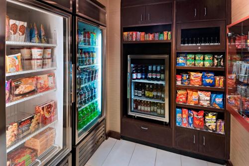 a refrigerator filled with lots of food and drinks at Residence Inn by Marriott Omaha West in Omaha