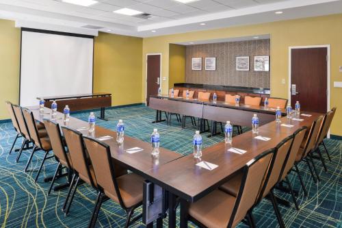 a large conference room with a long table and chairs at SpringHill Suites Fresno in Fresno