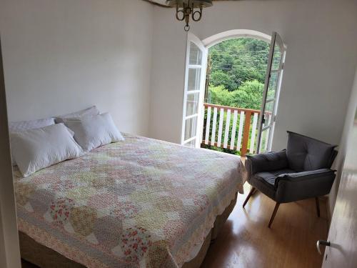 Ένα ή περισσότερα κρεβάτια σε δωμάτιο στο Casa Verde Campos, conforto e ótima localização