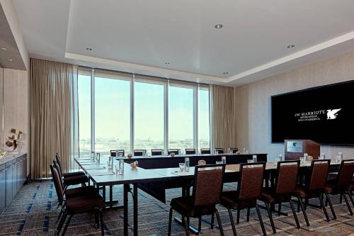 a conference room with a long table and chairs at JW Marriott Minneapolis Mall of America in Bloomington