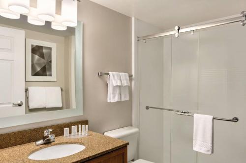 a bathroom with a sink and a shower at TownePlace Suites by Marriott Denver West Federal Center in Lakewood