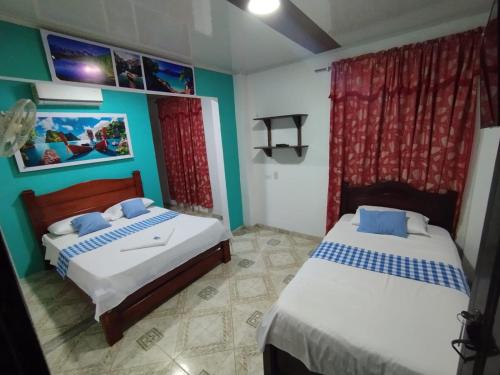 Postel nebo postele na pokoji v ubytování Hotel Sol y Mar