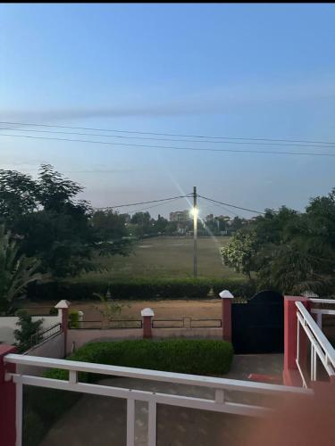 a view from the balcony of a house with a street light at Paradise Estate in Gambia in Old Yundum