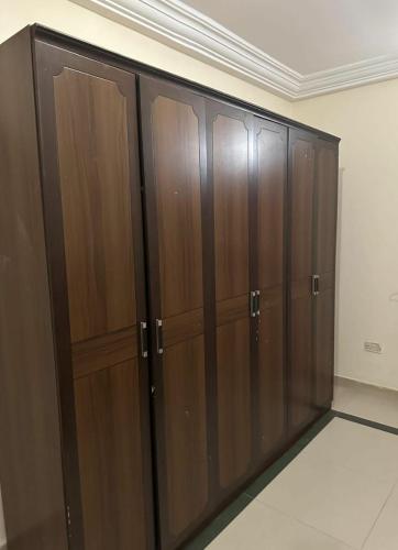 a row of wooden cabinets in a room at Paradise Estate in Gambia in Old Yundum