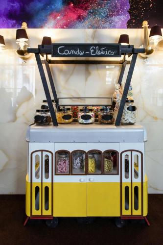 a yellow and white food truck with a sign on it at Sheraton Lisboa Hotel & Spa in Lisbon