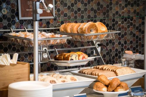 a bakery with various breads and pastries on display at SpringHill Suites by Marriott Fayetteville Fort Bragg in Fayetteville