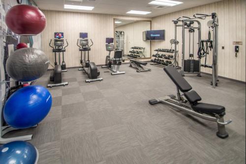 a gym with several treadmills and cardio machines at SpringHill Suites by Marriott Fayetteville Fort Bragg in Fayetteville