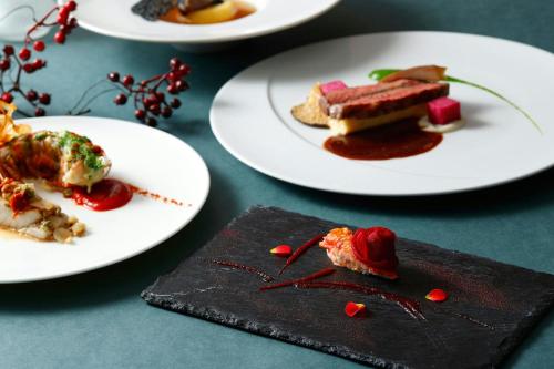 a group of plates of food on a table at Tokyo Marriott Hotel in Tokyo