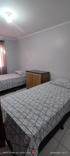 En eller flere senge i et værelse på Casa JARDIM AMÉRICA