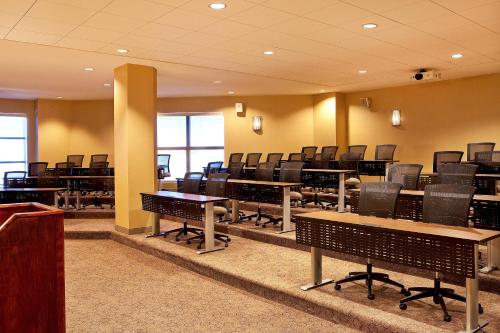 a conference room with desks and chairs in it at Sheraton Portsmouth Harborside Hotel in Portsmouth