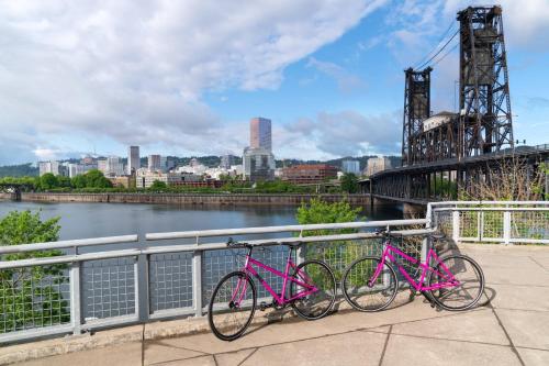 two bikes are parked next to a bridge at Moxy Portland Downtown in Portland