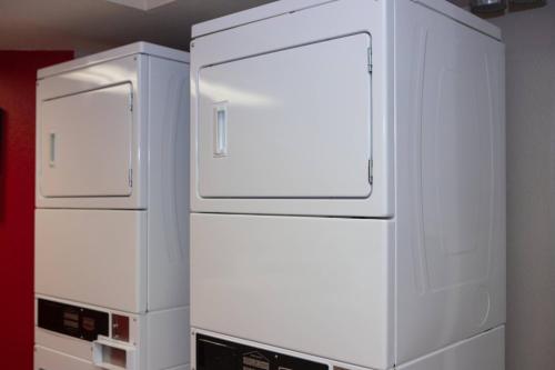 two white refrigerators sitting next to each other in a room at TownePlace Suites Denver Southwest/Littleton in Littleton