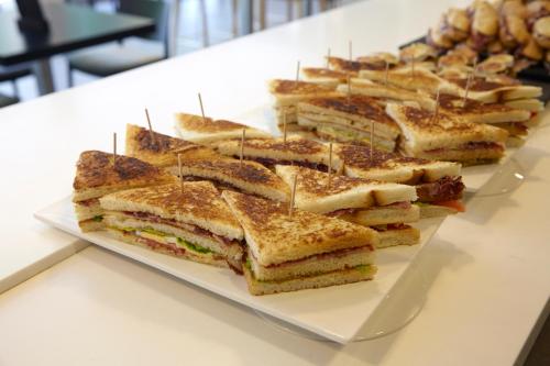 a plate of sandwiches sitting on a table at Hotel Zinema7 in Donostia-San Sebastián