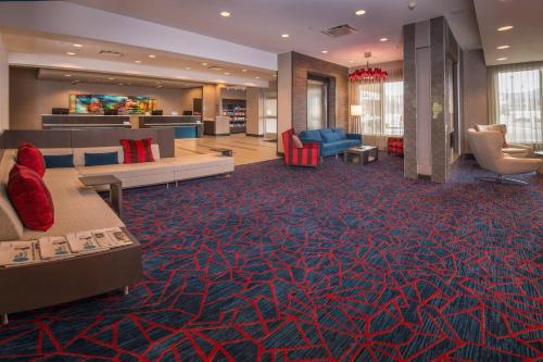 a lobby of a hotel with couches and chairs at TownePlace Suites by Marriott Altoona in Altoona