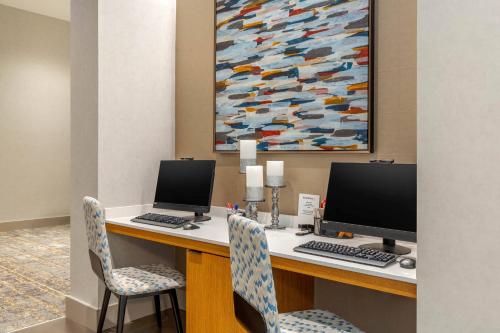 a desk with two computers and two chairs at Residence Inn Providence Downtown in Providence