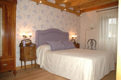 Ένα ή περισσότερα κρεβάτια σε δωμάτιο στο Agroturismo Urrutia