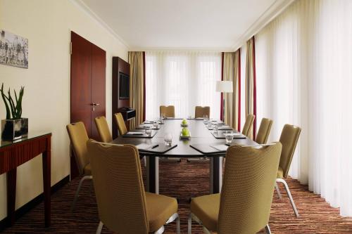 a conference room with a long table and chairs at Berlin Marriott Hotel in Berlin