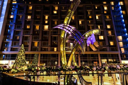 a christmas tree in front of a building at Marriott Marquis Washington, DC in Washington