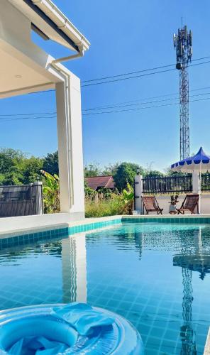 a swimming pool in a villa with a view at Sisters Real Escapes -Private Room With Private Bathroom in Mae Sot