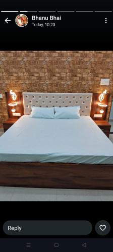 a bedroom with a bed with a white bedspread at Maa kamakhya home stay in Varanasi