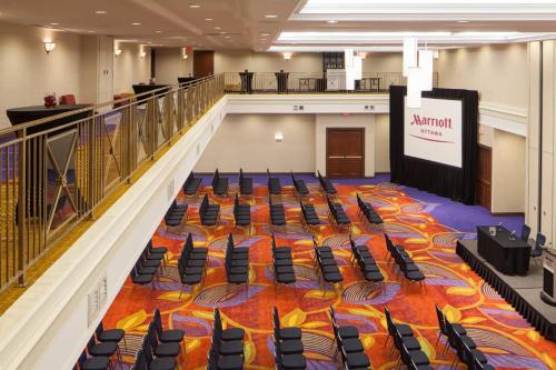 a large hall with chairs and a stage in the middle at Ottawa Marriott Hotel in Ottawa