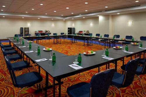 a large conference room with long tables and chairs at Ottawa Marriott Hotel in Ottawa
