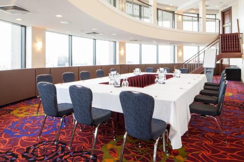 a conference room with a long table and chairs at Ottawa Marriott Hotel in Ottawa