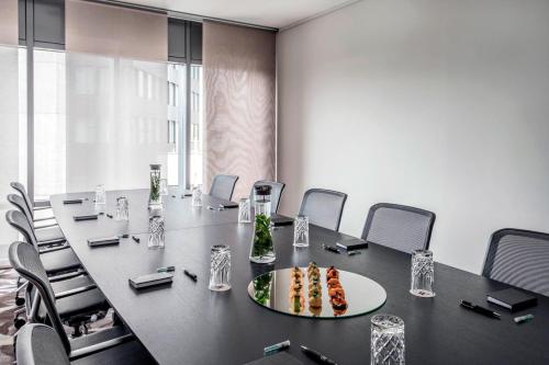 a conference room with a large table and chairs at Zurich Marriott Hotel in Zürich