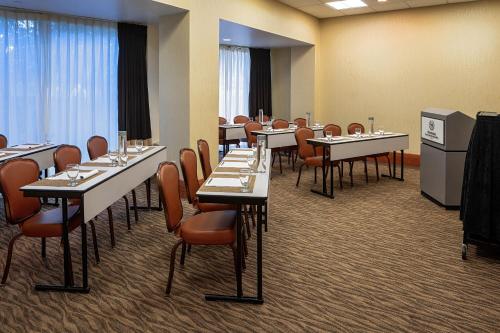 a conference room with tables and chairs with wine glasses at Sheraton Houston Brookhollow Hotel in Houston