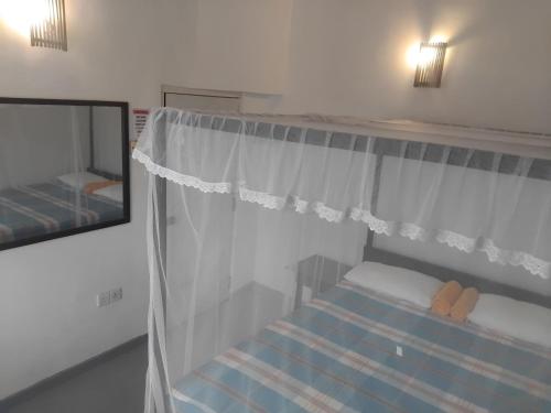 Postel nebo postele na pokoji v ubytování Moon House
