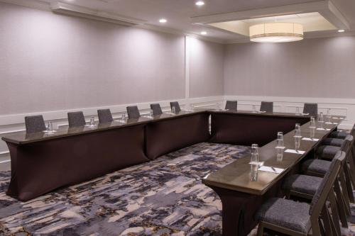 a conference room with a long table and chairs at Sheraton Ann Arbor Hotel in Ann Arbor