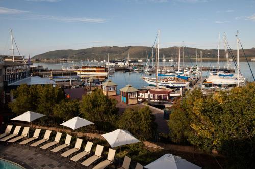 a view of a marina with boats in the water at Protea Hotel by Marriott Knysna Quays in Knysna