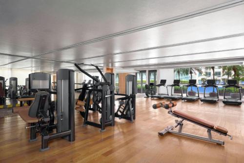 a gym with a bunch of treadmills and machines at JW Marriott Hotel and Suites Saigon in Ho Chi Minh City