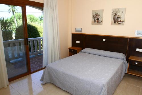 Voodi või voodid majutusasutuse Apartamentos Coral Do Mar III toas