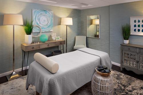 a bedroom with a bed and a table and a chair at The Westin Governor Morris, Morristown in Morristown
