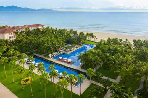an aerial view of a resort with a pool and the beach at Danang Marriott Resort & Spa in Danang