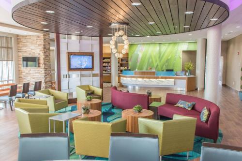 a lobby with colorful chairs and a waiting room at SpringHill Suites by Marriott Sumter in Sumter