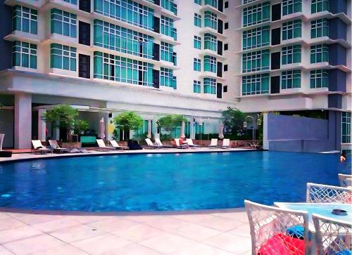 a large swimming pool in front of a building at KL Sentral Dua Sentral Cozy Homestay Apartments by Hollywood Homes #FreeCarPark in Kuala Lumpur