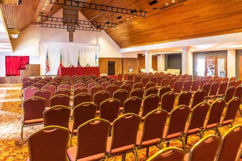 a large room with rows of chairs and a stage at Sheraton Bariloche Hotel in San Carlos de Bariloche