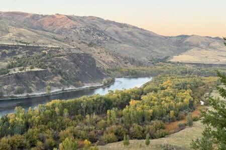 a view of a river with trees and mountains at Trails End Lodge in Irwin