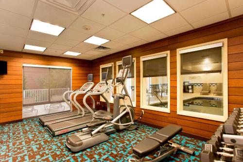 a gym with several tread machines in a room at Fairfield Inn and Suites by Marriott Winchester in Winchester