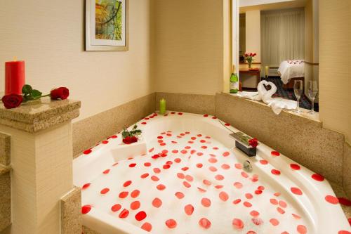 a bath tub covered in red roses in a bathroom at Fairfield Inn & Suites by Marriott Waco North in Waco