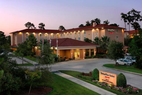 a hotel with a car parked in front of it at TownePlace Suites Houston Intercontinental Airport in Houston
