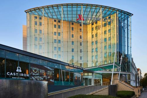 a tall building with a clock on top of it at London Marriott Hotel Kensington in London