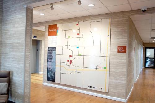a map on a wall in an office lobby at TownePlace Suites by Marriott Ames in Ames