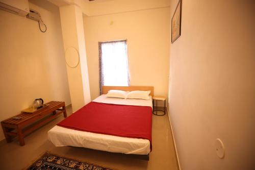 Ένα ή περισσότερα κρεβάτια σε δωμάτιο στο Lishikaa's Inn